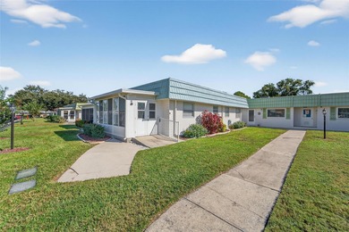 This bright condo features a living room-dining room combination on Sandpiper Golf Club in Florida - for sale on GolfHomes.com, golf home, golf lot