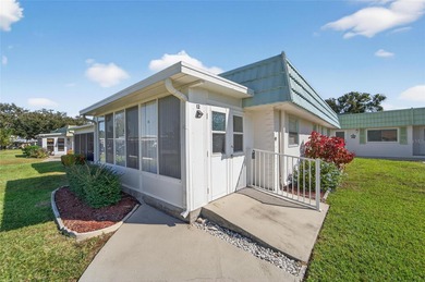 This bright condo features a living room-dining room combination on Sandpiper Golf Club in Florida - for sale on GolfHomes.com, golf home, golf lot