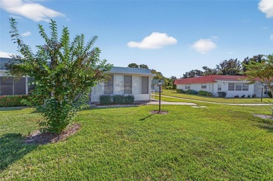 This bright condo features a living room-dining room combination on Sandpiper Golf Club in Florida - for sale on GolfHomes.com, golf home, golf lot
