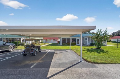 This bright condo features a living room-dining room combination on Sandpiper Golf Club in Florida - for sale on GolfHomes.com, golf home, golf lot