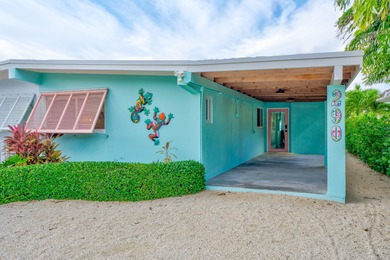 Step inside and experience the kind of tropical ease people on Key Colony Beach Golf Course in Florida - for sale on GolfHomes.com, golf home, golf lot