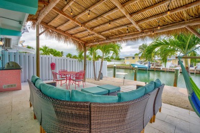 Step inside and experience the kind of tropical ease people on Key Colony Beach Golf Course in Florida - for sale on GolfHomes.com, golf home, golf lot