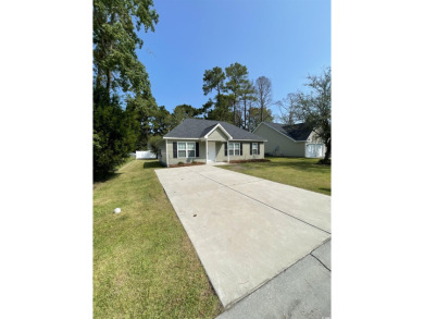 Great home located in a Golf Course community with no HOA.  This on Wedgefield Plantation Golf Club in South Carolina - for sale on GolfHomes.com, golf home, golf lot