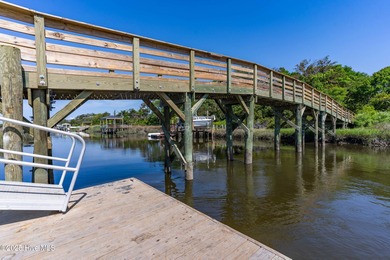 Welcome to 207 NE 67th Street, Oak Island - a warm and inviting on Founders Club At St. James Plantation in North Carolina - for sale on GolfHomes.com, golf home, golf lot