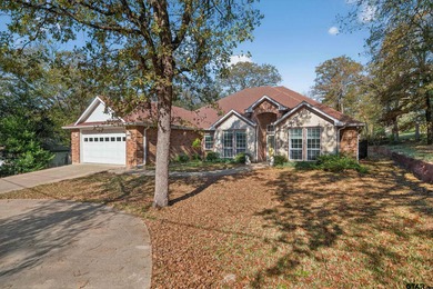This beautifully maintained 4-bedroom, 2-bath traditional brick on Hide-A-Way Lake Golf Course in Texas - for sale on GolfHomes.com, golf home, golf lot