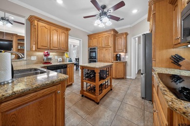 This beautifully maintained 4-bedroom, 2-bath traditional brick on Hide-A-Way Lake Golf Course in Texas - for sale on GolfHomes.com, golf home, golf lot