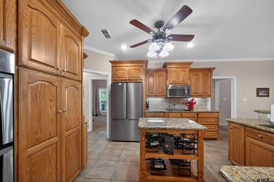 This beautifully maintained 4-bedroom, 2-bath traditional brick on Hide-A-Way Lake Golf Course in Texas - for sale on GolfHomes.com, golf home, golf lot