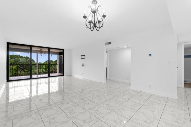 Beautifully renovated home with an amazing lake and golf view in on  in Florida - for sale on GolfHomes.com, golf home, golf lot