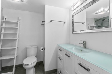 Beautifully renovated home with an amazing lake and golf view in on  in Florida - for sale on GolfHomes.com, golf home, golf lot