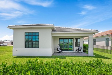 Stunning lakefront home in the gorgeous gated golf community of on The Tesoro Golf Course and Club in Florida - for sale on GolfHomes.com, golf home, golf lot