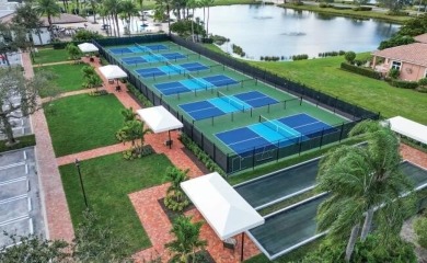 Stunning lakefront home in the gorgeous gated golf community of on The Tesoro Golf Course and Club in Florida - for sale on GolfHomes.com, golf home, golf lot