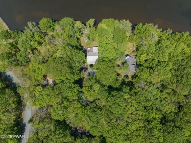 Welcome to your serene lakeside retreat in the highly desirable on Paupack Hills Golf and Country Club in Pennsylvania - for sale on GolfHomes.com, golf home, golf lot