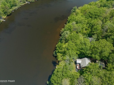 Welcome to your serene lakeside retreat in the highly desirable on Paupack Hills Golf and Country Club in Pennsylvania - for sale on GolfHomes.com, golf home, golf lot
