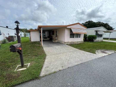 Priced to Sell in Hidden Golf - A Highly Sought-After 55+ Gated on Lake Henry Golf Club in Florida - for sale on GolfHomes.com, golf home, golf lot