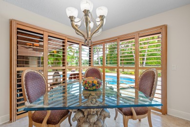 Welcome to 10984 Boca Woods Lane, an exquisite residence nestled on Boca Woods Country Club in Florida - for sale on GolfHomes.com, golf home, golf lot