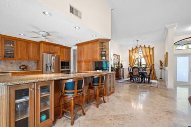 Welcome to 10984 Boca Woods Lane, an exquisite residence nestled on Boca Woods Country Club in Florida - for sale on GolfHomes.com, golf home, golf lot