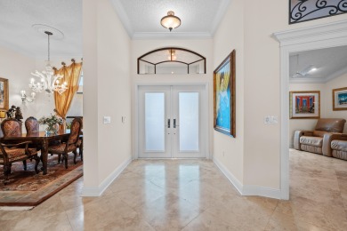 Welcome to 10984 Boca Woods Lane, an exquisite residence nestled on Boca Woods Country Club in Florida - for sale on GolfHomes.com, golf home, golf lot