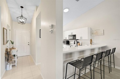 Discover this STUNNING 2-bedroom, 2-bathroom Second-floor condo on Peridia Golf and Country Club in Florida - for sale on GolfHomes.com, golf home, golf lot