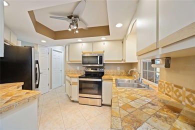 Welcome to this beautifully maintained 2-bedroom, 2-bath pool on Deep Creek Golf Club in Florida - for sale on GolfHomes.com, golf home, golf lot