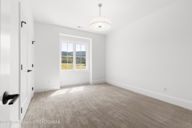 Step into Elevated Living at The Teton Reserve. Positioned along on Teton Reserve in Idaho - for sale on GolfHomes.com, golf home, golf lot