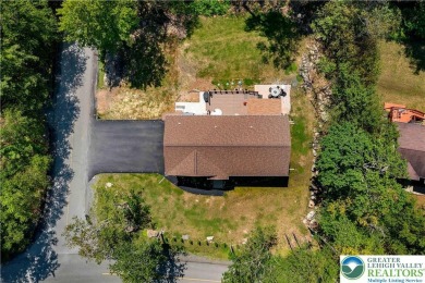 Welcome to this expansive 4-bedroom, 2.5-bath colonial offering on Pocono Farms Country Club in Pennsylvania - for sale on GolfHomes.com, golf home, golf lot