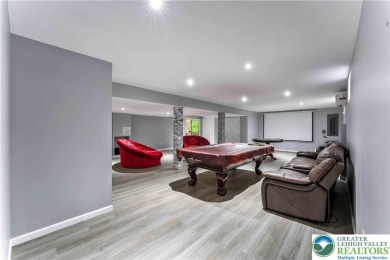 Welcome to this expansive 4-bedroom, 2.5-bath colonial offering on Pocono Farms Country Club in Pennsylvania - for sale on GolfHomes.com, golf home, golf lot