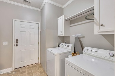 Welcome to your perfect waterfront retreat! This 3-bedroom on The Bridges Golf Club At Hollywood Casino in Mississippi - for sale on GolfHomes.com, golf home, golf lot