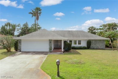 Stately home with grey stone trim.  Very well maintained on on Whiskey Creek Country Club in Florida - for sale on GolfHomes.com, golf home, golf lot