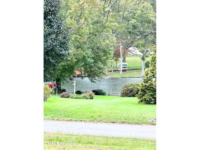 Water view! Nearly an acre total in these two gorgeous, cleared on Lake Tansi Village Country Club in Tennessee - for sale on GolfHomes.com, golf home, golf lot