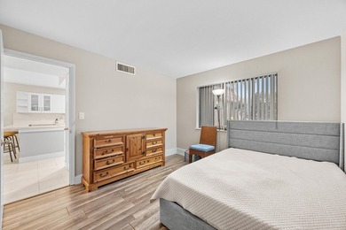 Wake up to tranquil lake and golf course views in this on Fountains Golf and Country Club in Florida - for sale on GolfHomes.com, golf home, golf lot