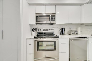 Enjoy breathtaking views from this 2 Bedroom 2 Bath corner unit on The President Country Club in Florida - for sale on GolfHomes.com, golf home, golf lot