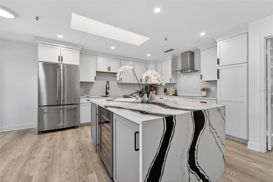 Situated behind gates of the coveted Bay Isles on Longboat Key on Longboat Key Golf Club Resort in Florida - for sale on GolfHomes.com, golf home, golf lot