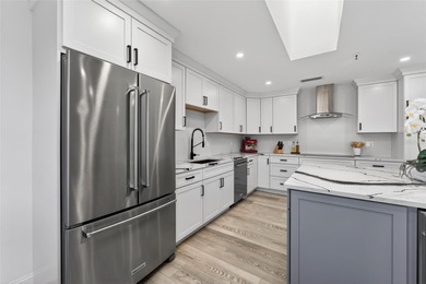 Situated behind gates of the coveted Bay Isles on Longboat Key on Longboat Key Golf Club Resort in Florida - for sale on GolfHomes.com, golf home, golf lot