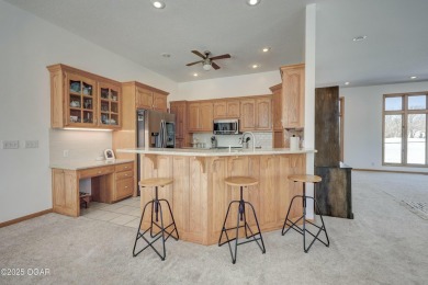 This impressive, full-brick home is locatd on a spacious golf on The Bald Eagle Course At Eagle Creek Golf Club in Missouri - for sale on GolfHomes.com, golf home, golf lot