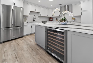 Situated behind gates of the coveted Bay Isles on Longboat Key on Longboat Key Golf Club Resort in Florida - for sale on GolfHomes.com, golf home, golf lot