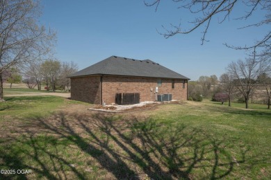 This impressive, full-brick home is locatd on a spacious golf on The Bald Eagle Course At Eagle Creek Golf Club in Missouri - for sale on GolfHomes.com, golf home, golf lot