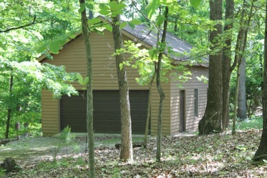 Check out this charming, cozy cabin w/ a fantastic corner lot on Hide-A-Way Hills Golf Club in Ohio - for sale on GolfHomes.com, golf home, golf lot