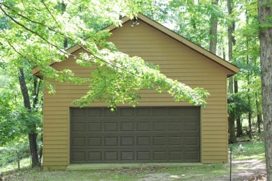 Check out this charming, cozy cabin w/ a fantastic corner lot on Hide-A-Way Hills Golf Club in Ohio - for sale on GolfHomes.com, golf home, golf lot