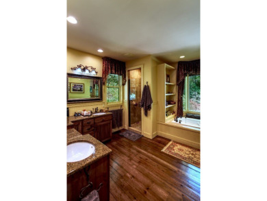 This stunning home sits on a private 2.45 ac. lot with lots of on Lake Toxaway Country Club in North Carolina - for sale on GolfHomes.com, golf home, golf lot