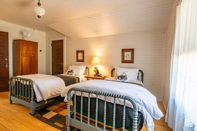 Discover the charm of this immaculate historic cottage at Upper on Saranac Inn Golf and Country Club in New York - for sale on GolfHomes.com, golf home, golf lot