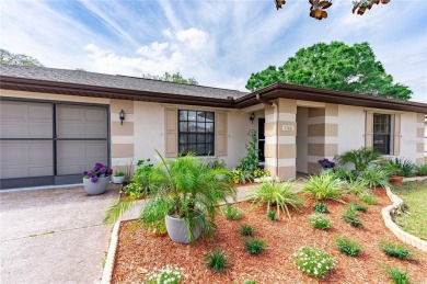 Beautifuly landscaped and well maintained 2/2 Home with 2 car on Sherman Hills Golf Club in Florida - for sale on GolfHomes.com, golf home, golf lot