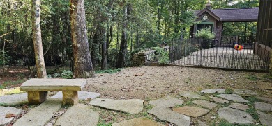 This stunning home sits on a private 2.45 ac. lot with lots of on Lake Toxaway Country Club in North Carolina - for sale on GolfHomes.com, golf home, golf lot