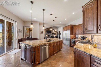 Experience luxurious Colorado living in this stunning on Kings Deer Golf Club in Colorado - for sale on GolfHomes.com, golf home, golf lot