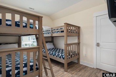 This turnkey 5-bedroom, 3.5-bath home in Ocean Lakes Section O on The Currituck Golf Club in North Carolina - for sale on GolfHomes.com, golf home, golf lot