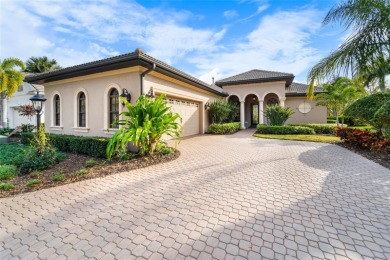 This exquisite home epitomizes elegance. Enter through the iron on Lakewood Ranch Golf and Country Club in Florida - for sale on GolfHomes.com, golf home, golf lot