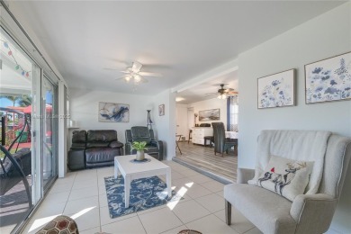 Beautifully updated 3/2 home with an open floor plan located on on Davie Golf Club in Florida - for sale on GolfHomes.com, golf home, golf lot