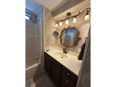 This great manufactured home on leased land is located in Lake on Pine Lakes Country Club in Florida - for sale on GolfHomes.com, golf home, golf lot