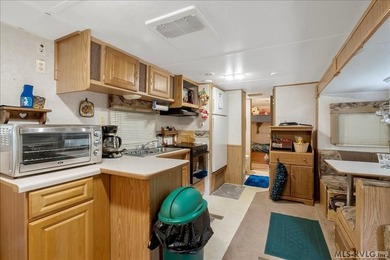 Back on the market, this charming 3 bedroom 1 bath 1999 camper on River Ridge Golf Club in Virginia - for sale on GolfHomes.com, golf home, golf lot