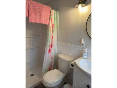 This great manufactured home on leased land is located in Lake on Pine Lakes Country Club in Florida - for sale on GolfHomes.com, golf home, golf lot