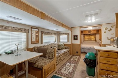 Back on the market, this charming 3 bedroom 1 bath 1999 camper on River Ridge Golf Club in Virginia - for sale on GolfHomes.com, golf home, golf lot